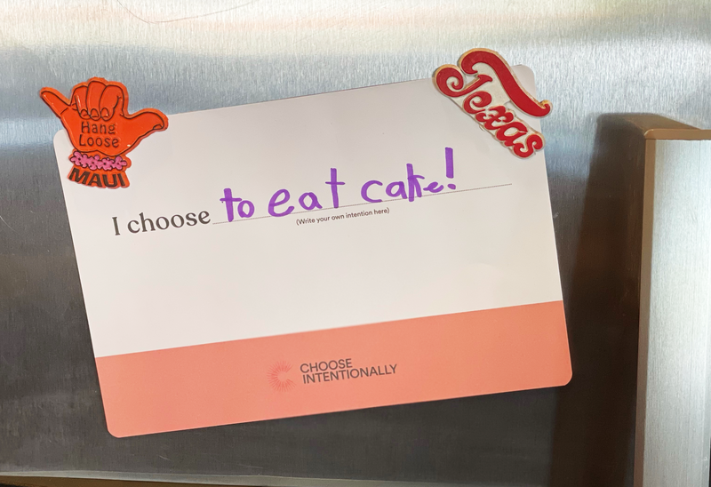 Photograph of custom Intention "I choose to eat cake!" magnetized to a fridge.